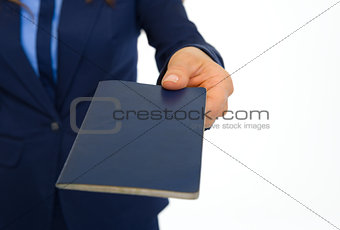 Closeup on business woman giving passport