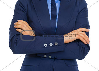 Closeup on business woman with crossed arms on chest