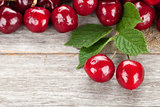 Ripe cherries on wooden table