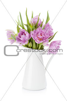 Pink tulips bouquet in pitcher