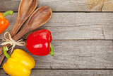 Colorful bell peppers and kitchen utensils