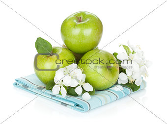 Ripe green apples and flowers