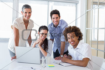 Business people smiling to camera