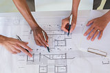 Team of architects going over blueprints
