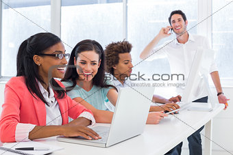 Casual business people working at desk