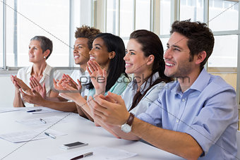 Business people clapping after presentation