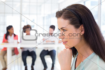 Attractive businesswoman being thoughtful