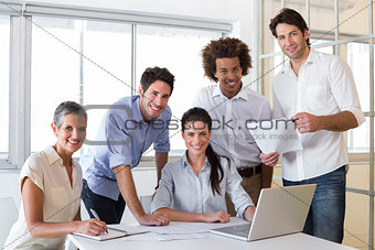 Attractive business people smiling in the workplace