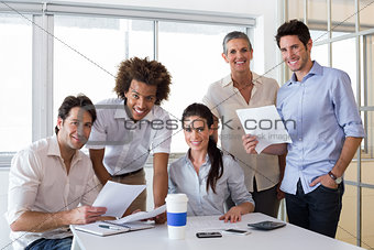 Attractive business people smiling in the workplace