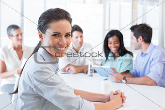 Attractive businesswoman smiling in the workplace