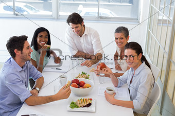 Workers enjoying sandwiches for lunch