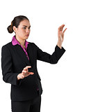 Serious businesswoman in suit gesturing with hands