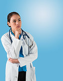 Serious doctor in lab coat thinking with hand on chin