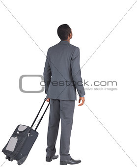 Businessman standing with his suitcase