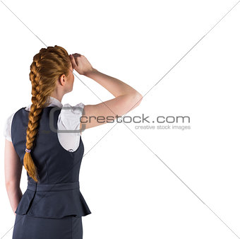 Redhead businesswoman standing and looking