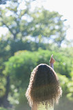 Young girl pointing to the sky in the park