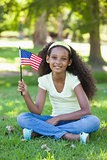 Young girl celebrating independence day in the park