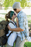 Active cute couple embracing each other on a hike