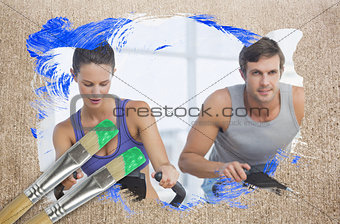 Composite image of couple working out in gym