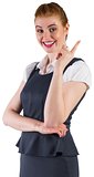 Redhead businesswoman pointing and smiling