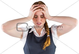 Stressed businesswoman with hands on head