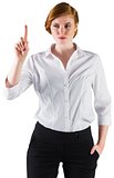 Businesswoman standing and pointing