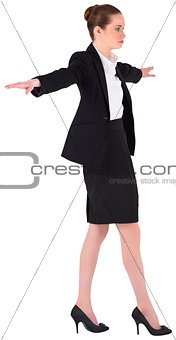 Businesswoman performing a balancing act