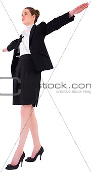 Businesswoman performing a balancing act