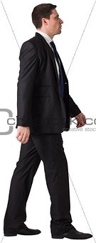 Handsome businessman in suit stepping