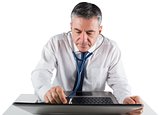 Mature businessman running diagnostics on laptop