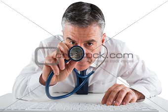 Mature businessman running diagnostics with stethoscope