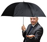 Mature businessman holding an umbrella