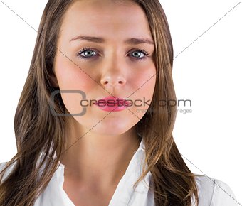 Serious young woman in white shirt
