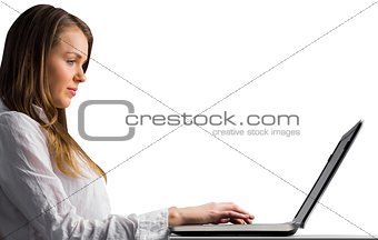 Businesswoman typing on her laptop
