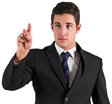 Young businessman standing and pointing