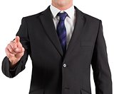 Businessman in suit standing and pointing