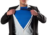 Businessman opening his shirt superhero style