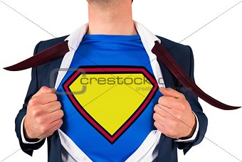 Businessman opening shirt in superhero style