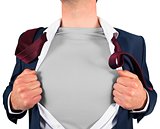 Businessman opening shirt in superhero style