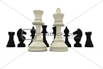 White king and queen standing in front of black pieces