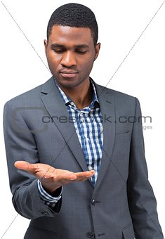 Focused businessman holding hand out