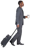 Young businessman pulling his suitcase