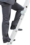 Businessman climbing up ladder
