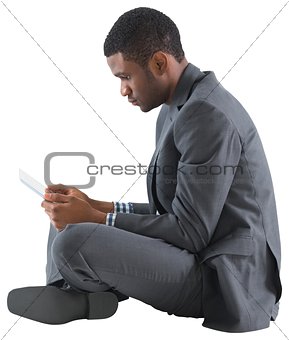 Businessman sitting and holding tablet