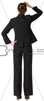 Businesswoman standing and thinking