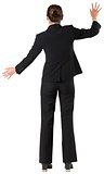 Businesswoman standing with arms up