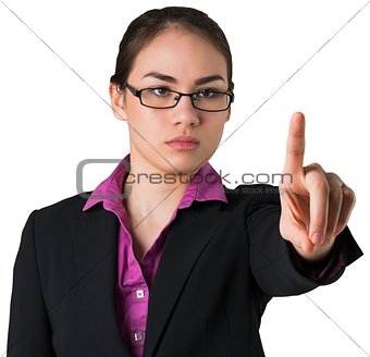 Serious businesswoman pointing