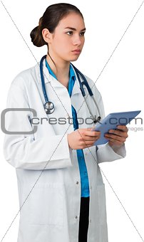 Young doctor standing with tablet pc