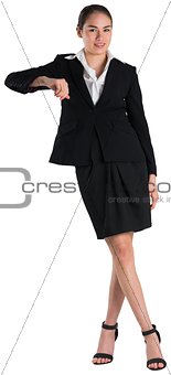 Young businesswoman standing and leaning