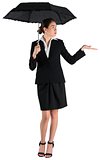 Young businesswoman holding umbrella